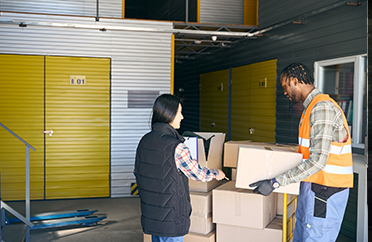 Customers moving boxes to their storage unit.